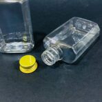 ⁦دستة علب بلاستيك مستطيلة شفافة 100 مل 12 شيشة غطاء ذهبي متعددة الاستعمالات⁩ - الصورة ⁦2⁩