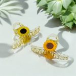 مساكة شعر ترند راقية وردة عباد الشمس لون عسلي / برتقالي & أسود