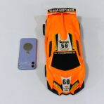 ⁦لعبة سيارة لامبرغيني دفع للأطفال ، لون برتقالي مميز ، بدون بطاريات⁩ - الصورة ⁦2⁩